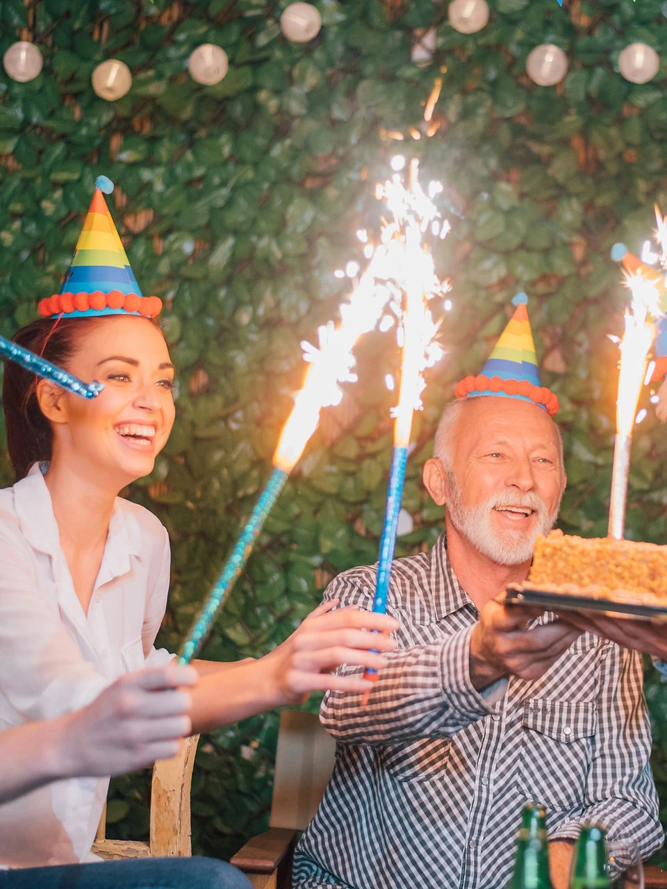 Family celebrating a birthday with sparklers